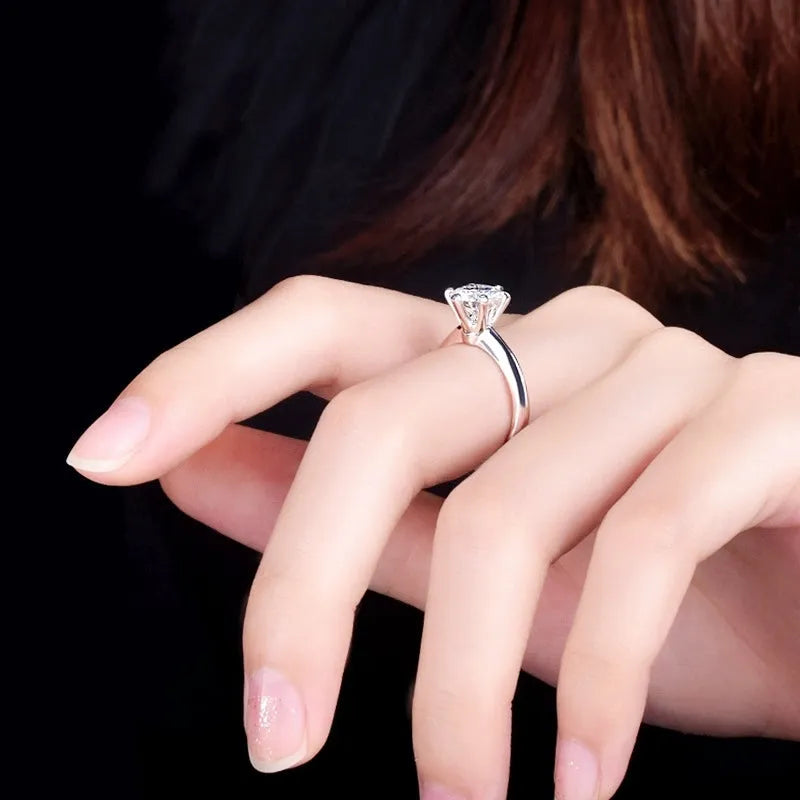 White gold plated women's ring with six-claw zircon setting and geometric band design