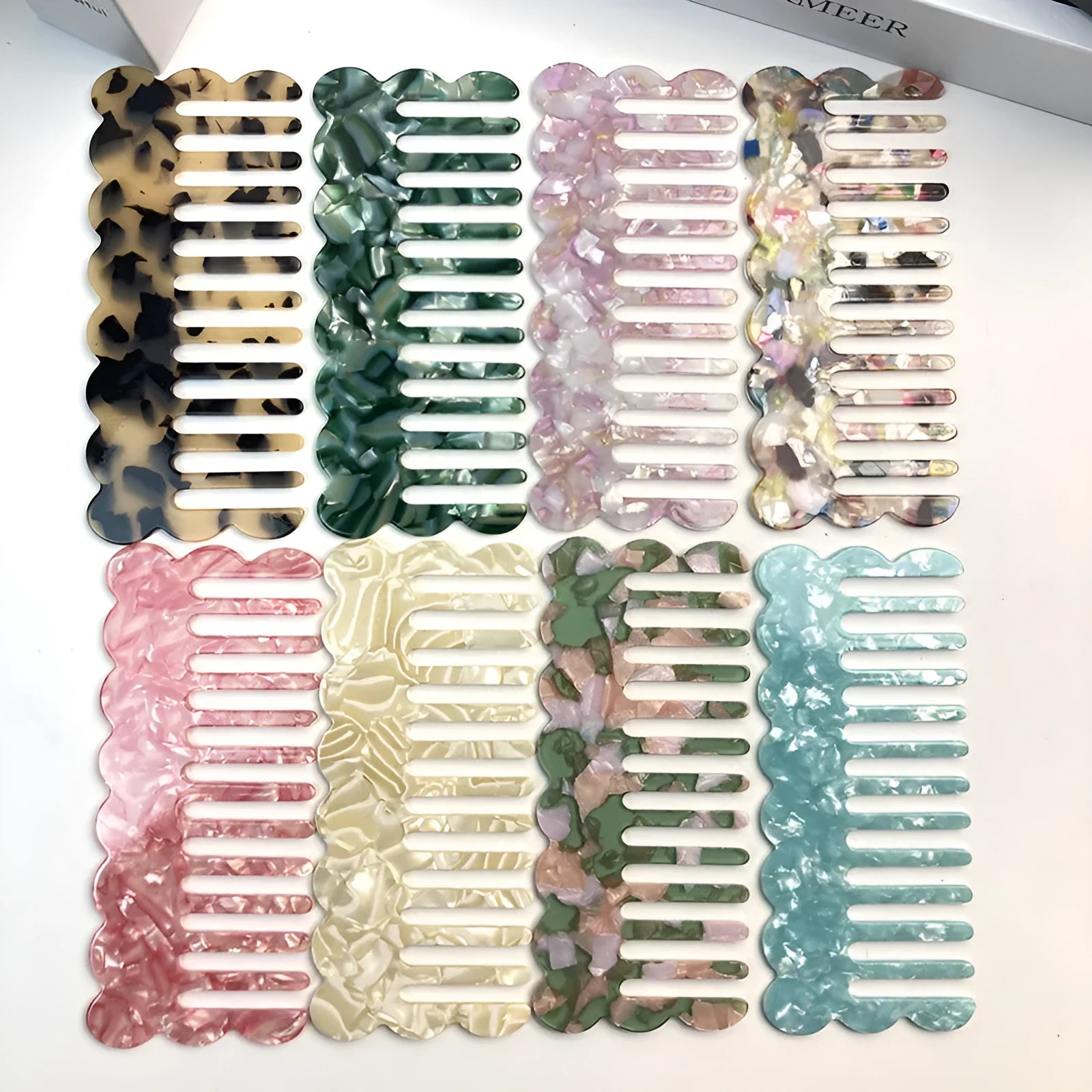 Acetate hair comb with geometric retro wave design in various colours.