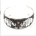 Ethnic carved open Miao silver alloy bracelet with Roman styling in turtle colour finish