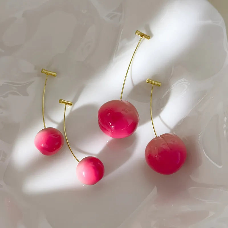 Juicy Peach fruit-shaped acrylic earrings on copper posts, shown in small and large size variants.