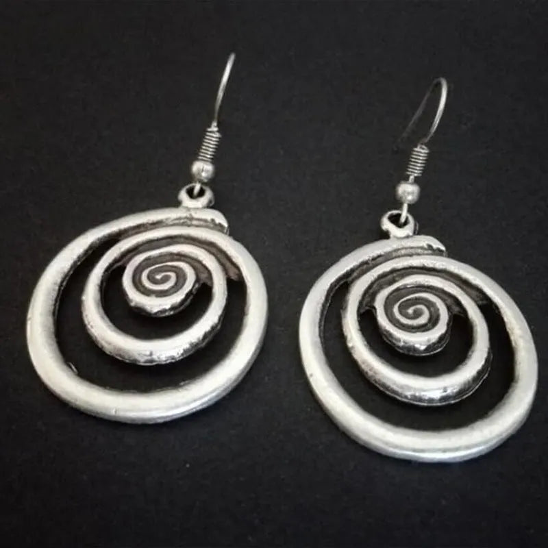 Silver alloy geometric spiral distressed drop earrings with national style, shown front-on.