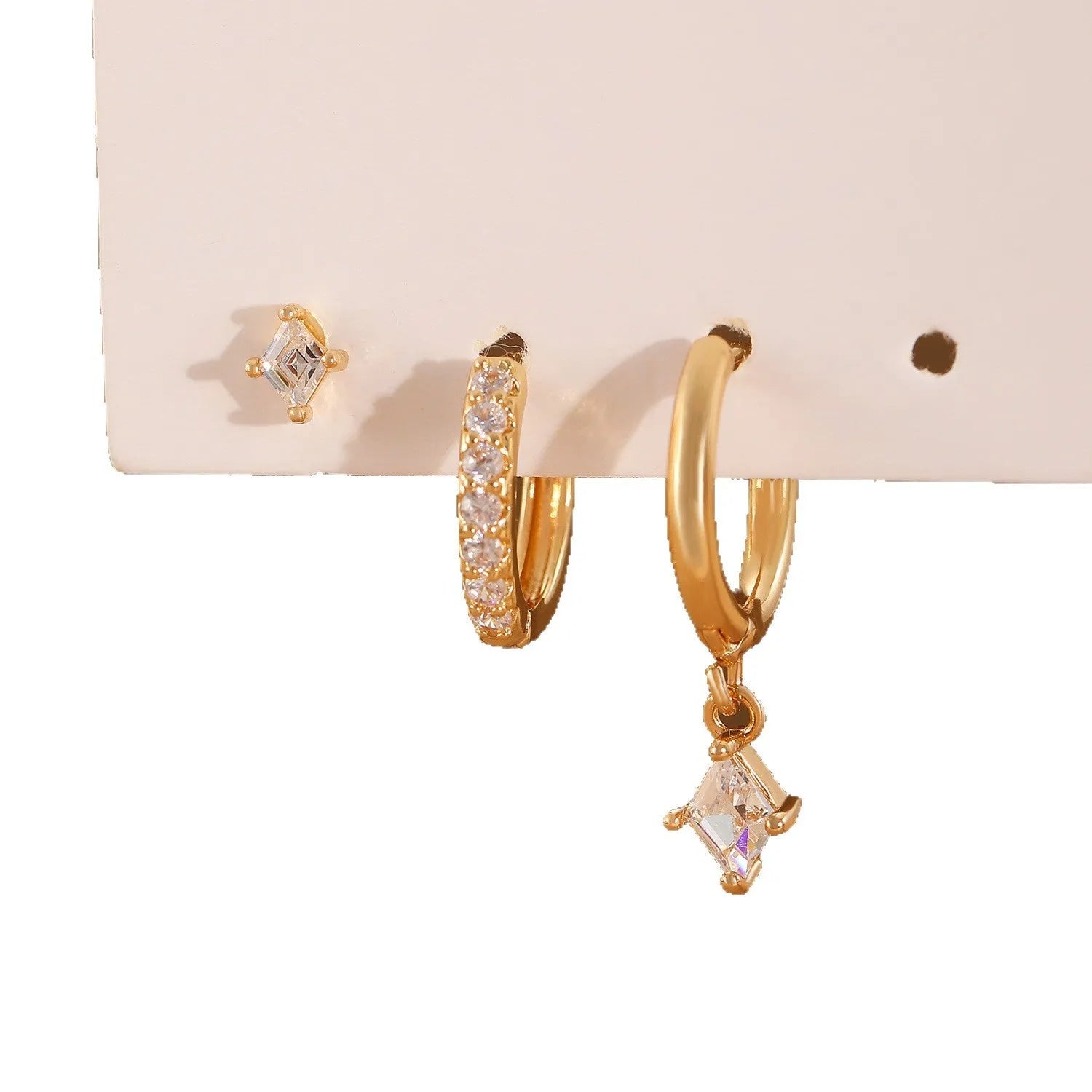 Ladies three-piece earring set with geometric design and zircon inlaid accents in gold colour