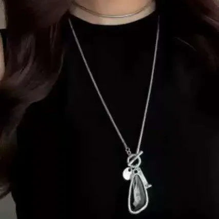 Women's geometric alloy pendant necklace with snake bones chain in blue, champagne, or grey.
