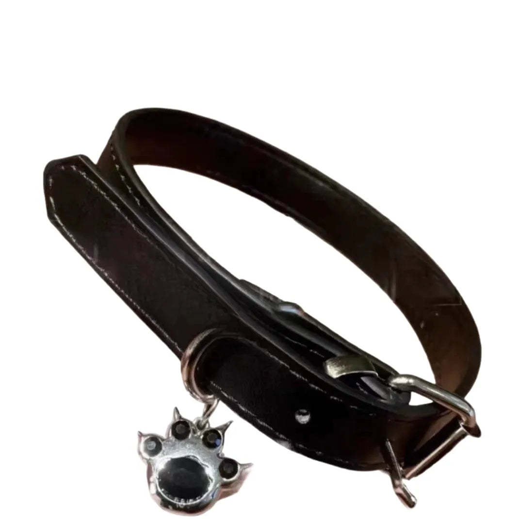 Black adjustable dog collar showing LD leather, bone, and cat paw design options