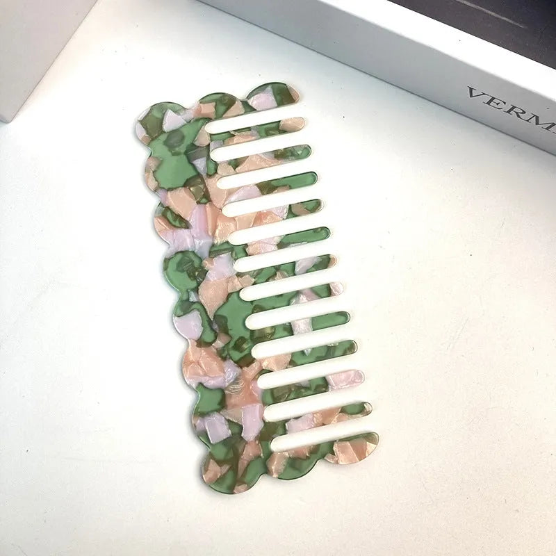 Acetate hair comb with geometric retro wave design in various colours.
