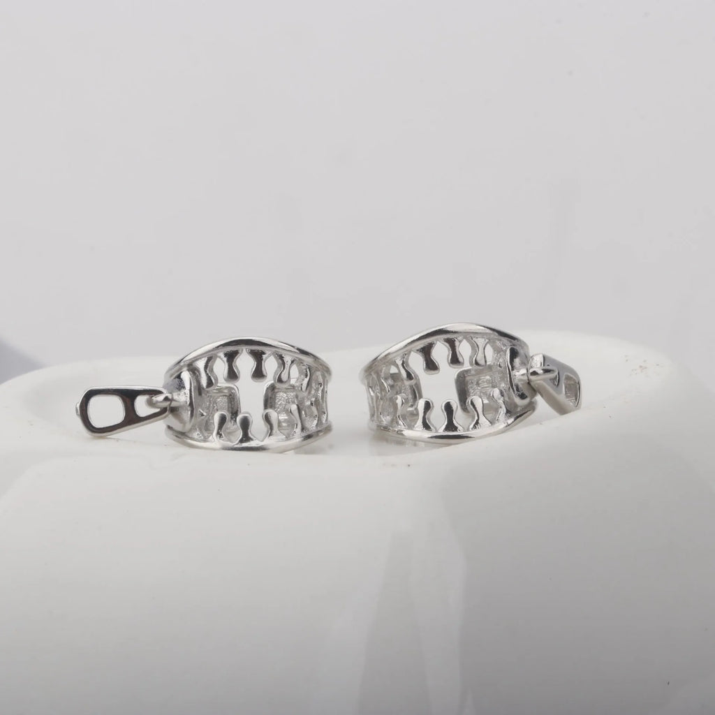 A pair of geometric-shaped copper ear clips with a zipper design detail, colour ES862.