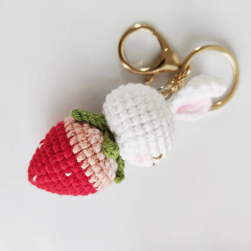 White hand-woven wire pendant with rabbit strawberry pattern and keychain attachment