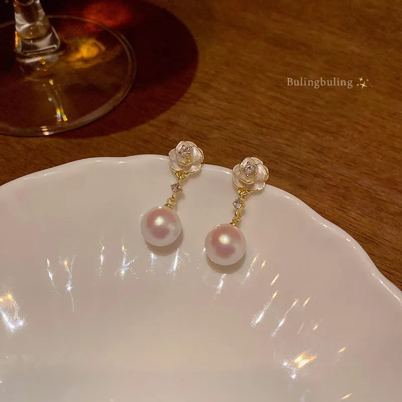 Camellia flower-shaped stud earrings in alloy with floral detailing