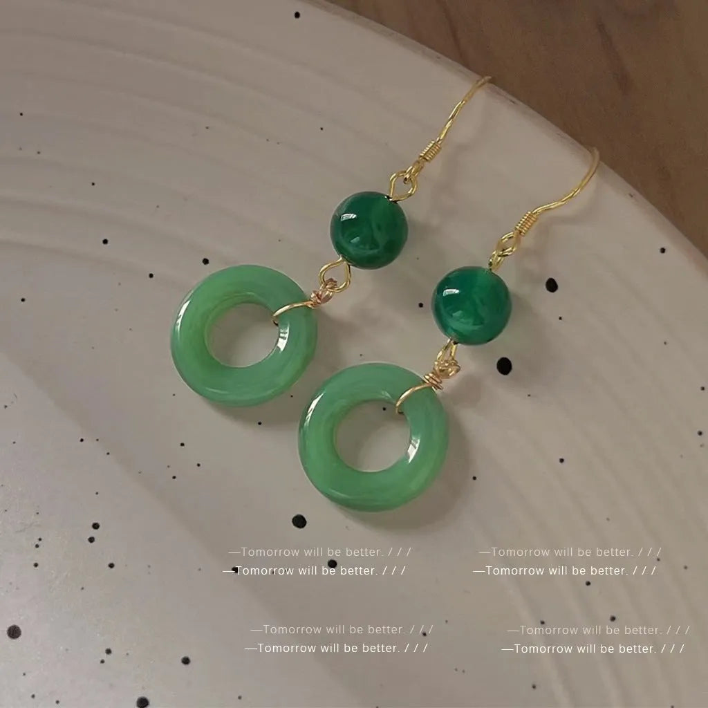 Green Chinese style peace buckle motif earrings with geometry shape and ring design elements