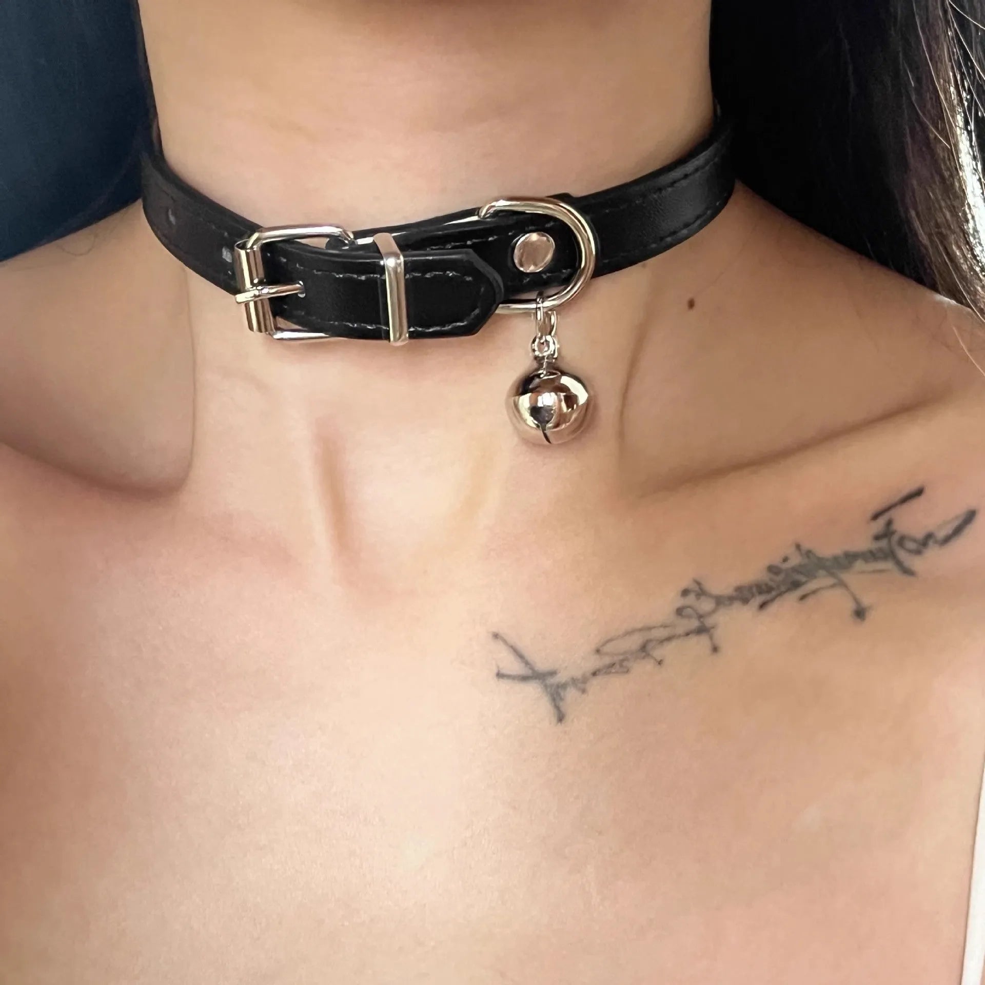 Black adjustable dog collar showing LD leather, bone, and cat paw design options