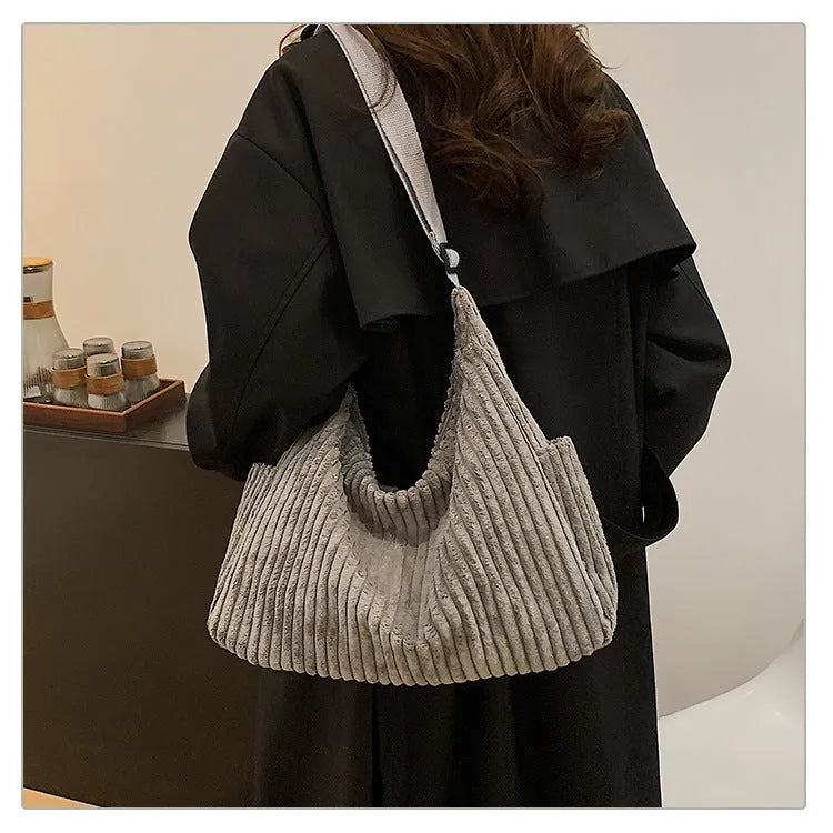 Corduroy crossbody bag in black, white or grey with single strap and sandwich pocket