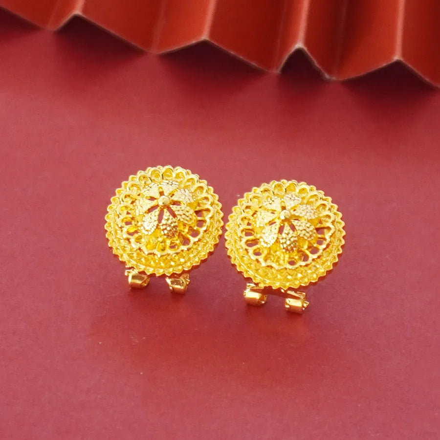 Gold-plated three-piece jewellery set with floral design pendant, matching earrings and ring on water wave chain