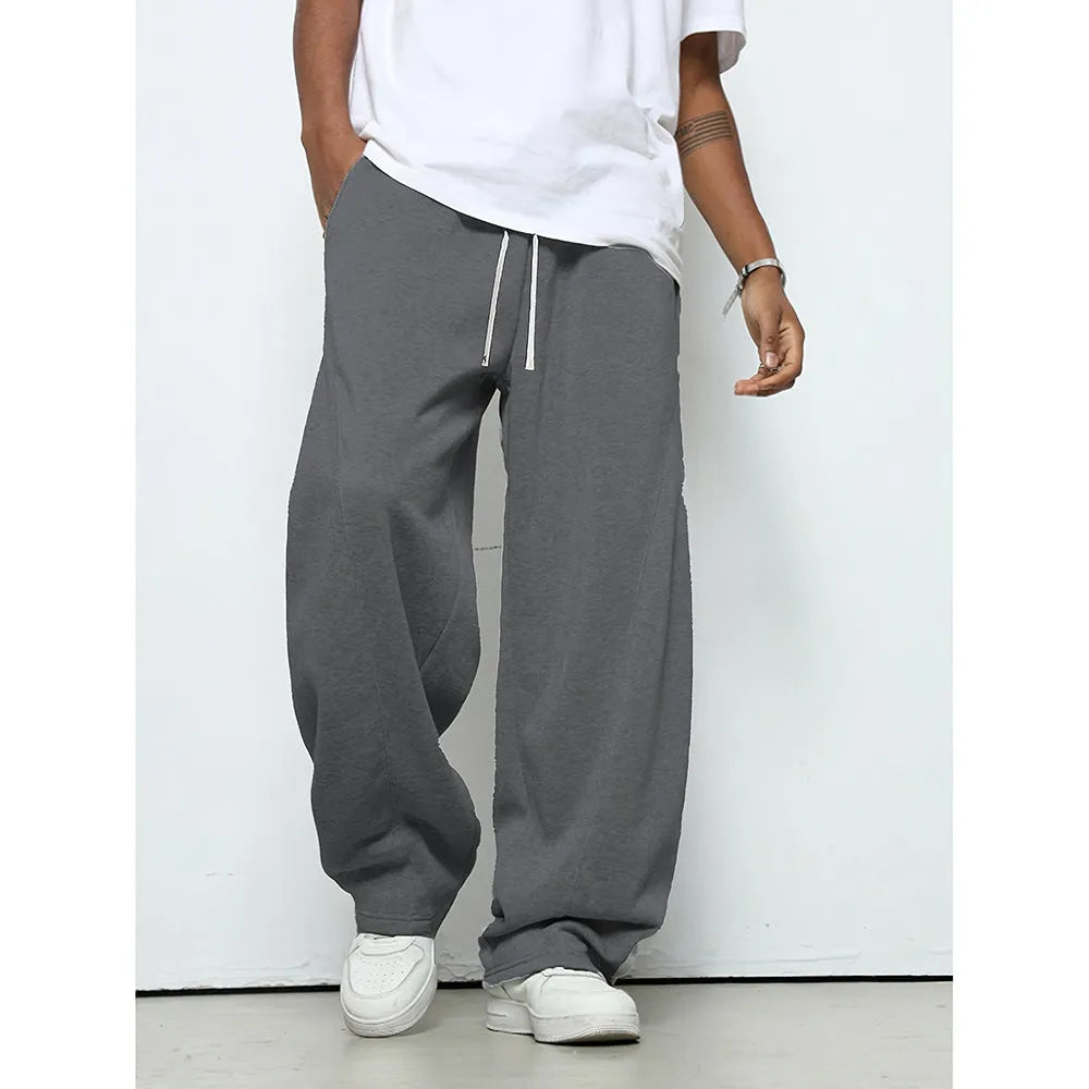 Men's solid colour casual trousers with a micro-elastic waistband and straight-leg cut.
