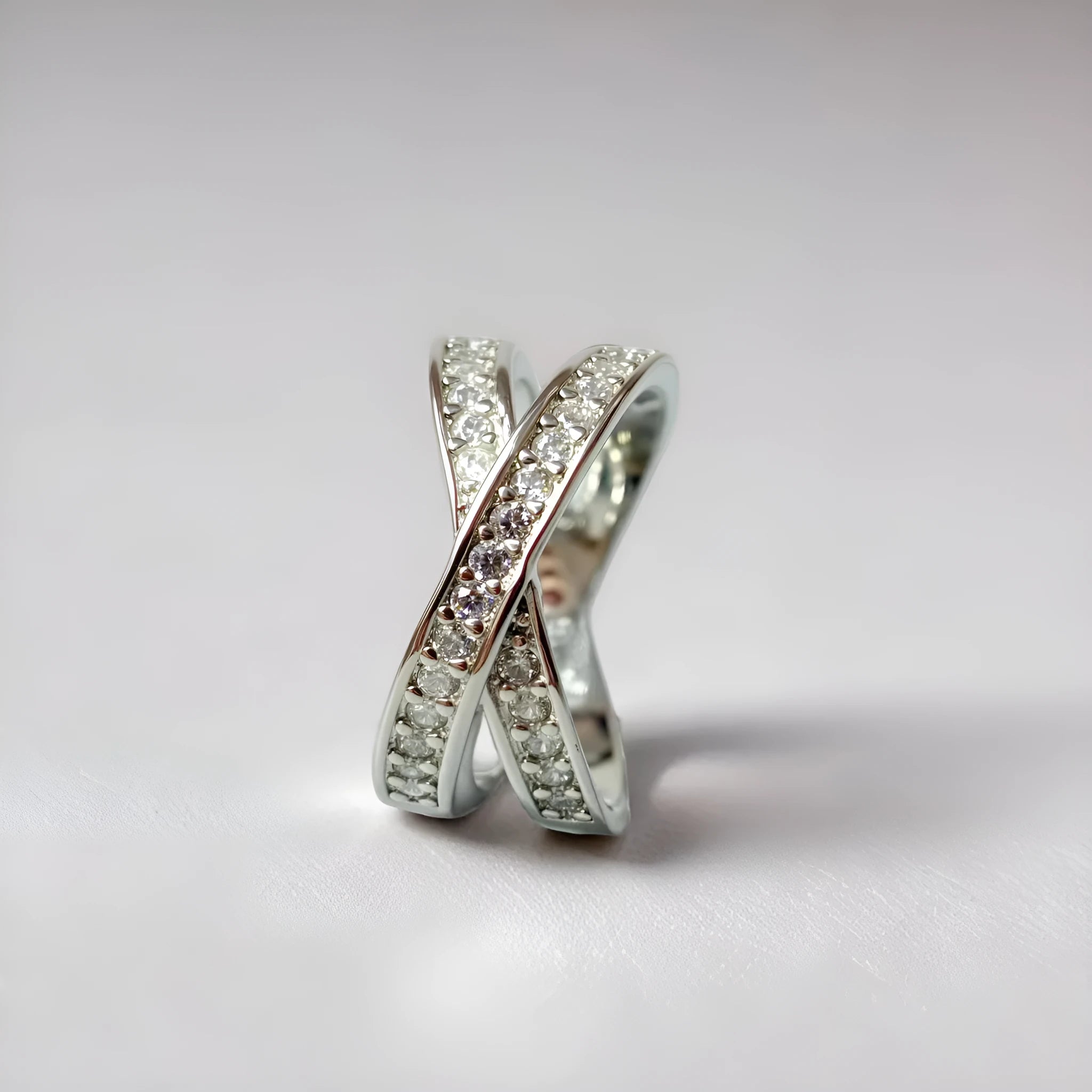 Metal cross ring with micro-inlaid zircon detailing in silver or rose gold electroplated finish