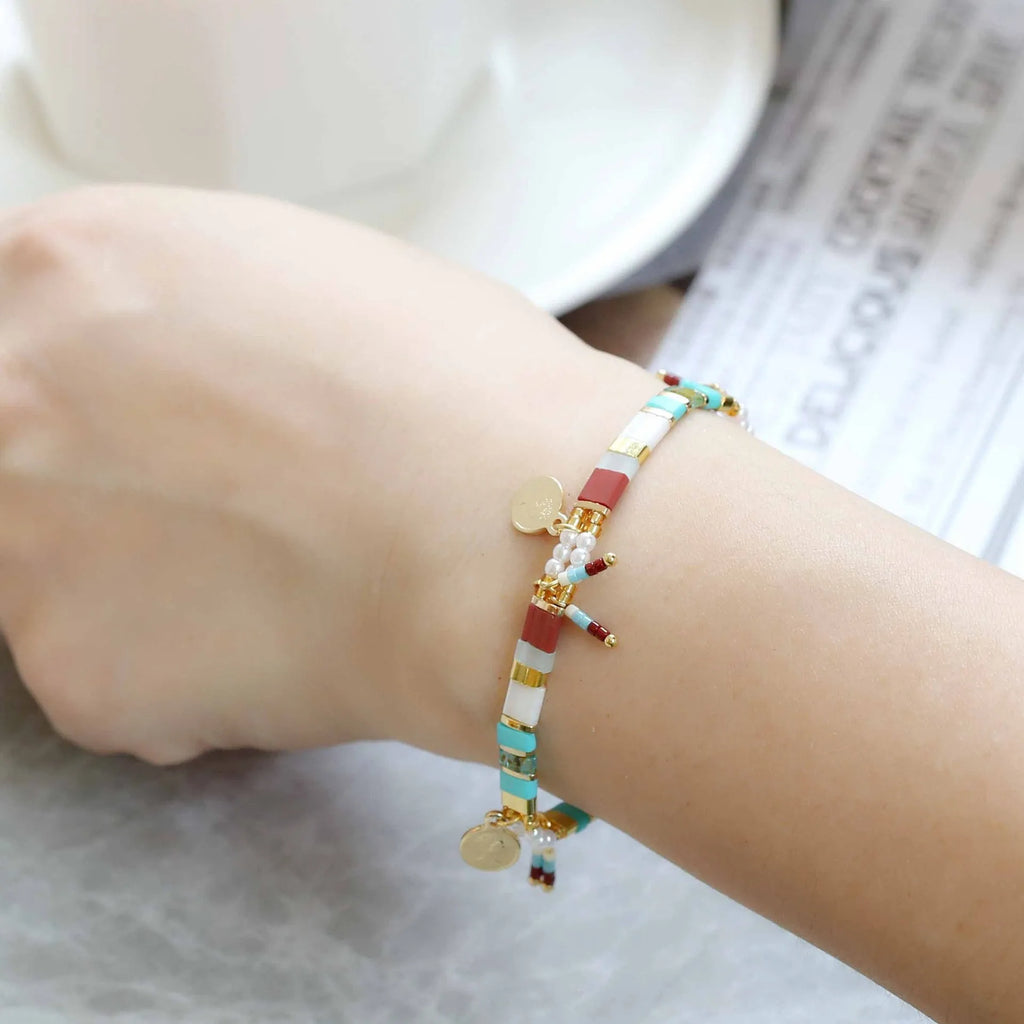Women's handcrafted bracelet with imitation pearl beads in a European/American style design.