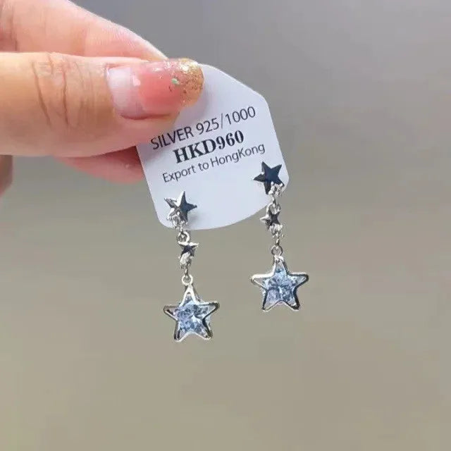 Geometric heart shaped women's ear clips with rhinestone stars and dangling tassel details