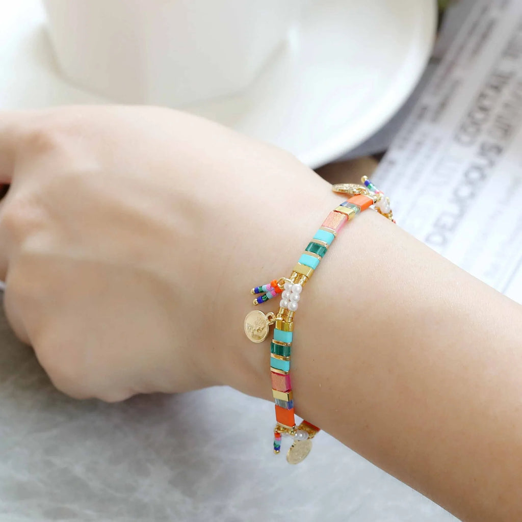 Women's handcrafted bracelet with imitation pearl beads in a European/American style design.