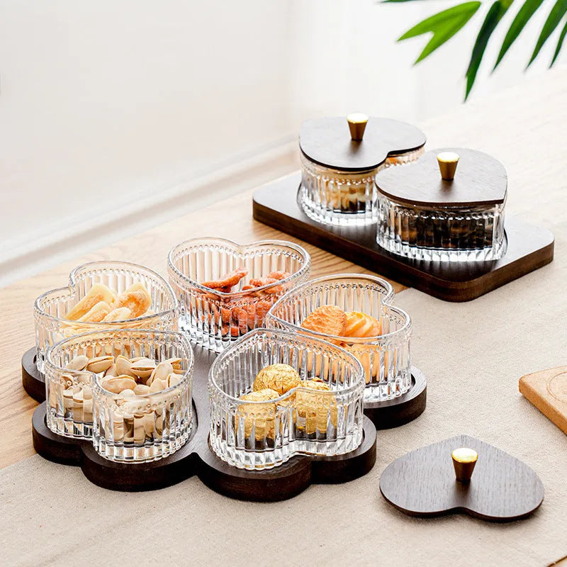Glass snack platter with choice of 2, 3, 4, or 5 transparent heart-shaped bowls with lids on an irregular tray.