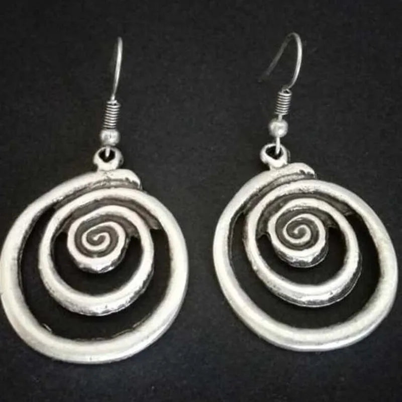 Silver alloy geometric spiral distressed drop earrings with national style, shown front-on.