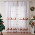 A pair of American-style Christmas curtains with white embroidered snowflakes on a red background.