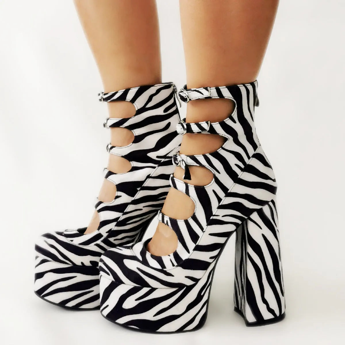 Women's black patent leather platform high heels with thick serrated heel and buckle fastening