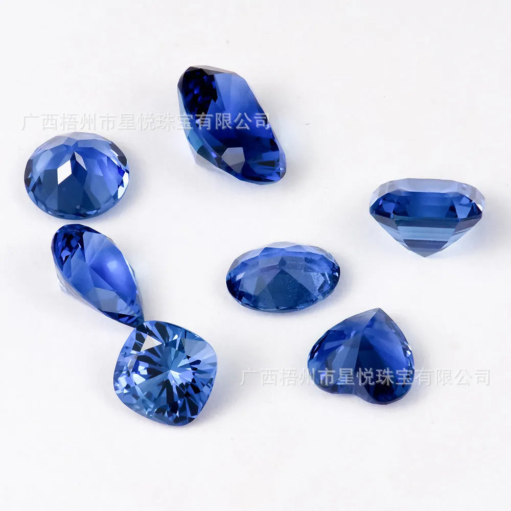 Royal blue loose gemstones in heart, round, egg, fat square, pear, and asche cuts for jewellery making
