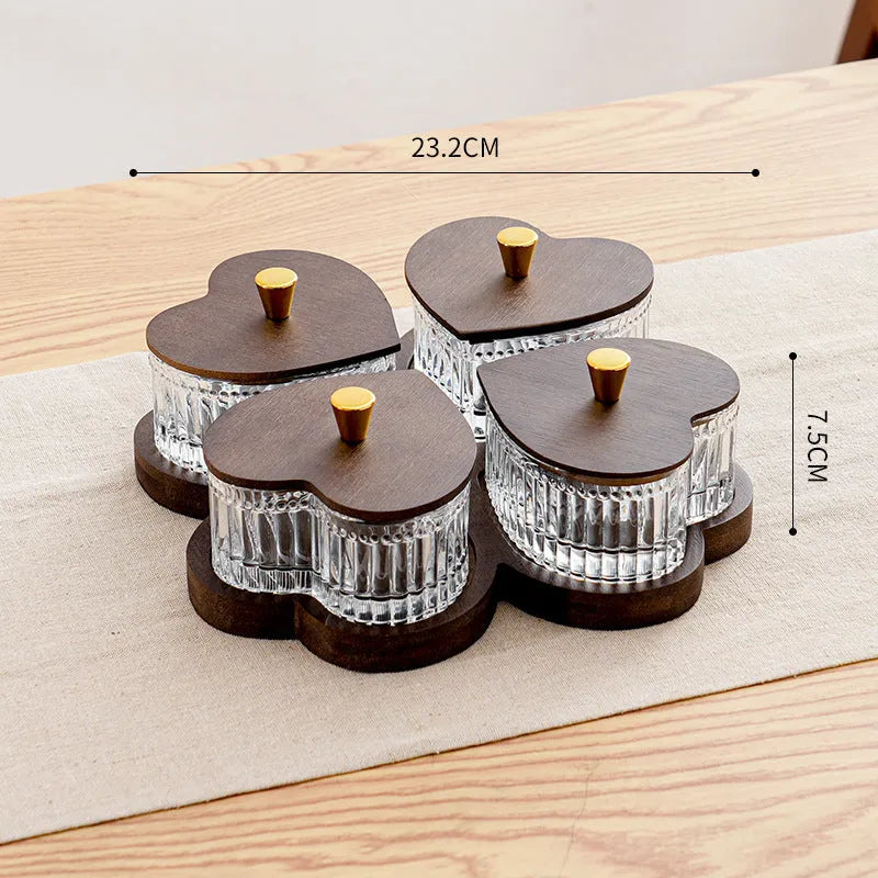 Glass snack platter with choice of 2, 3, 4, or 5 transparent heart-shaped bowls with lids on an irregular tray.