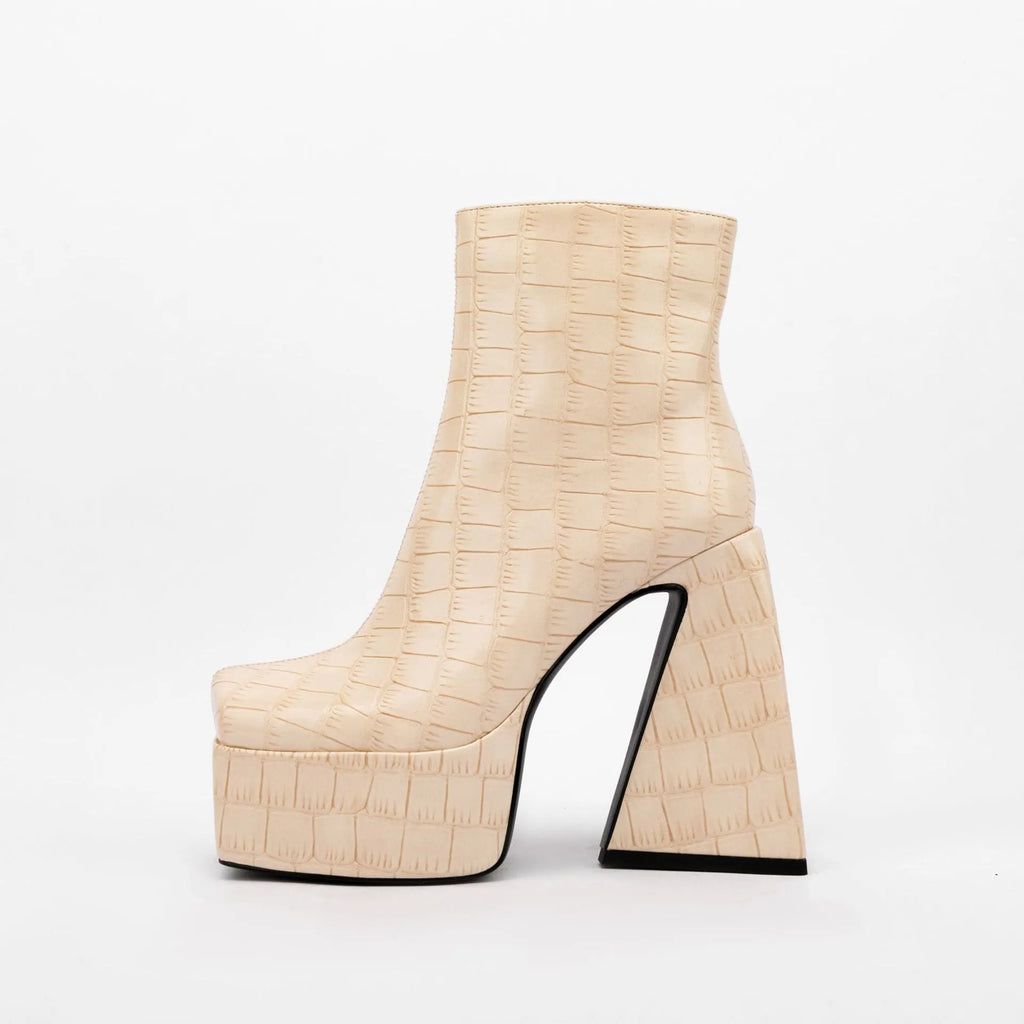 Women's ankle boots with a super high heel in artificial PU, shown in beige colour.