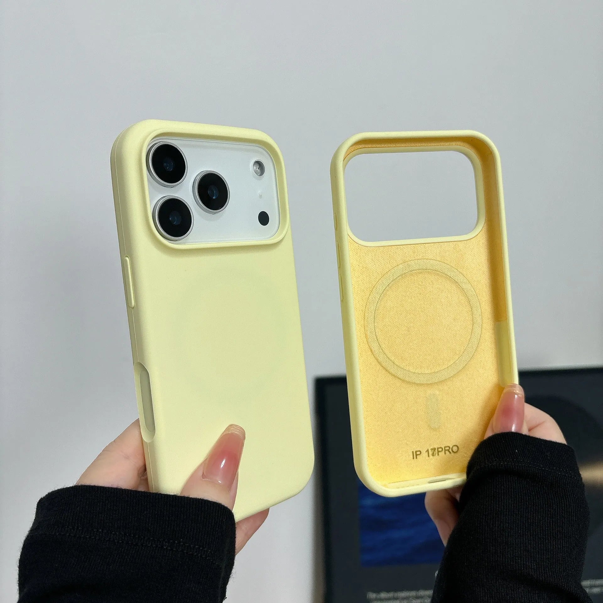 Liquid silicone magnetic charging phone case with Ai button for iPhone, shown in antique white colour.