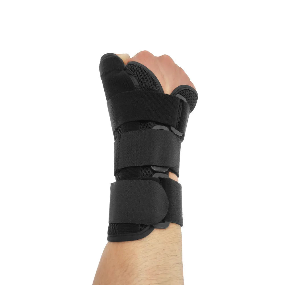 Black carbon fibre wrist guard with thumb strap and grey edging, shown for left hand.