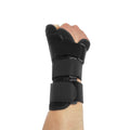 Black carbon fibre wrist guard with thumb strap and grey edging, shown for left hand.