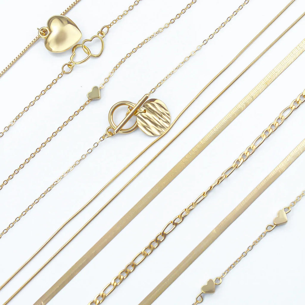 Gold electroplated women's necklace jewellery set with snake chain construction and alloy pendants