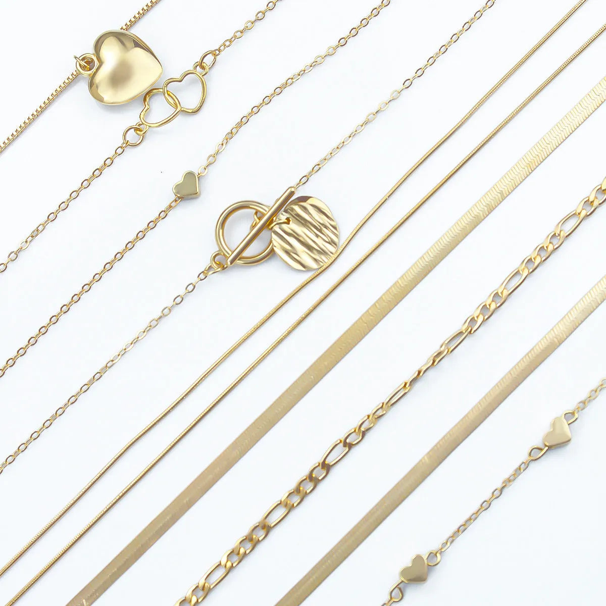Gold electroplated women's necklace jewellery set with snake chain construction and alloy pendants