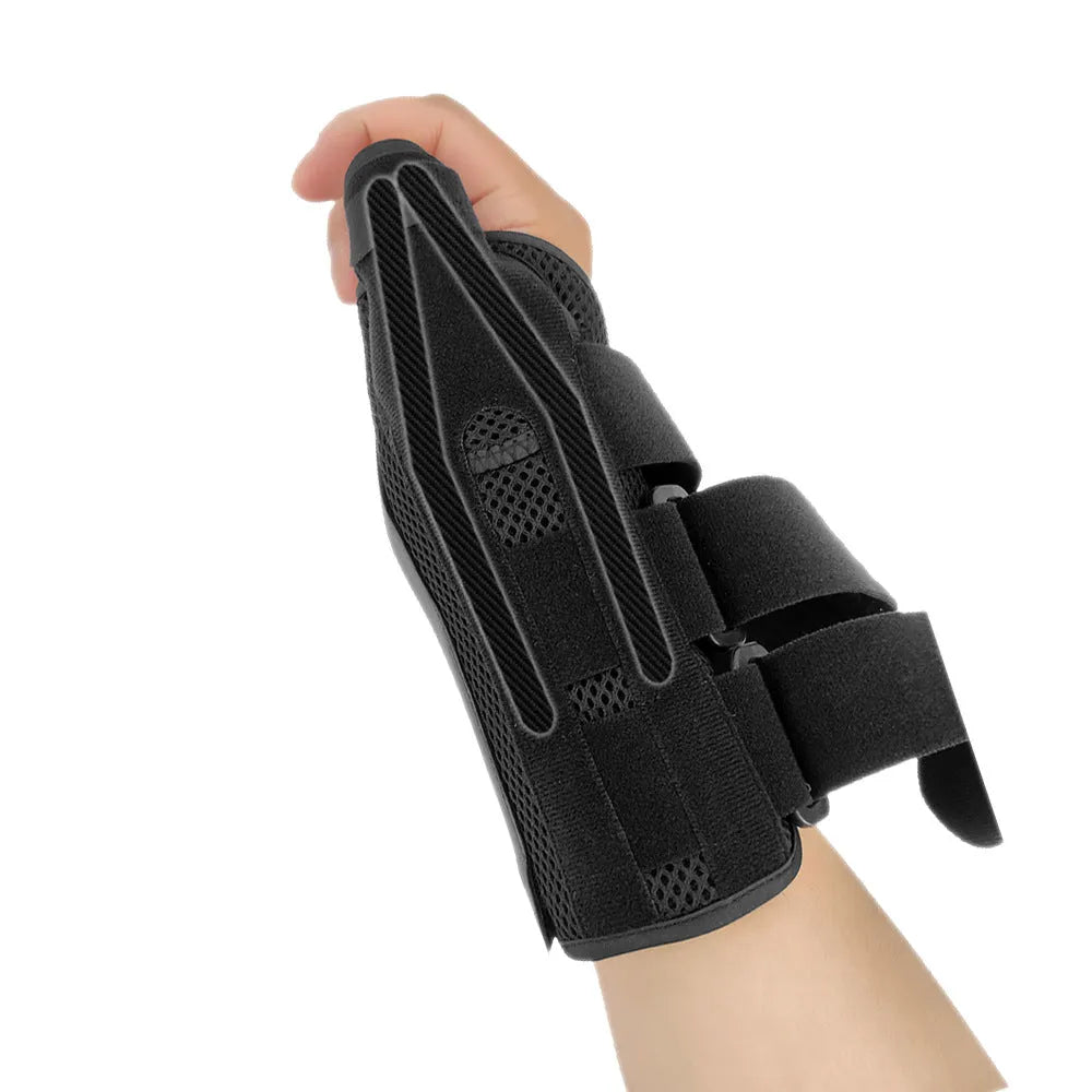 Black carbon fibre wrist guard with thumb strap and grey edging, shown for left hand.