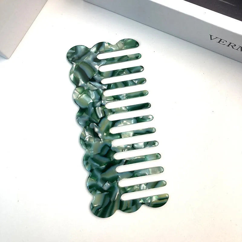 Acetate hair comb with geometric retro wave design in various colours.