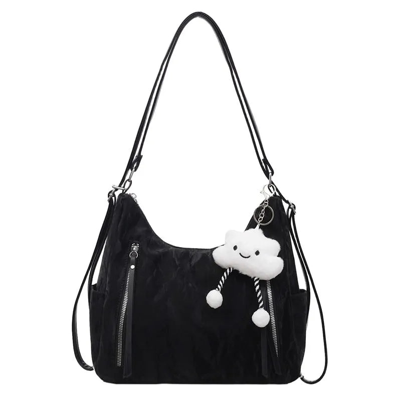 Women's soft PU leather fashion backpack in black, white, silver, or blue colour with pendant accessory