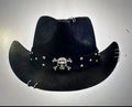 Brown curved edge Western cowboy hat with a conical crown on a wooden post