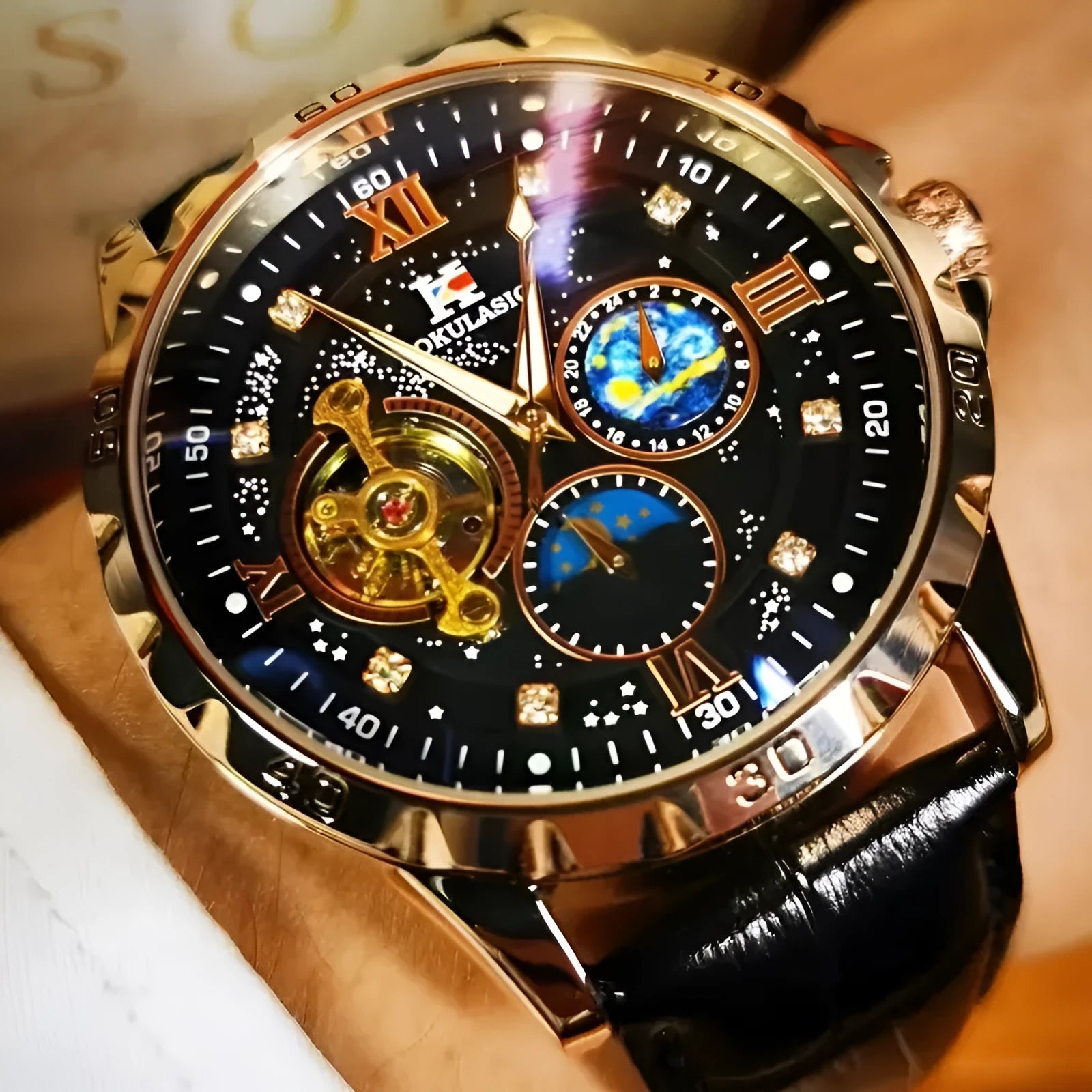 Large dial automatic mechanical watch with rose gold case, black leather strap, and visible skeleton movement