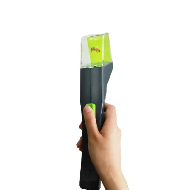 Green handheld plastic insect catcher for garden and lawn pest control
