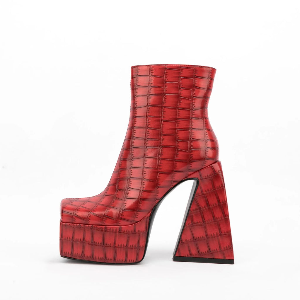 Women's ankle boots with a super high heel in artificial PU, shown in beige colour.