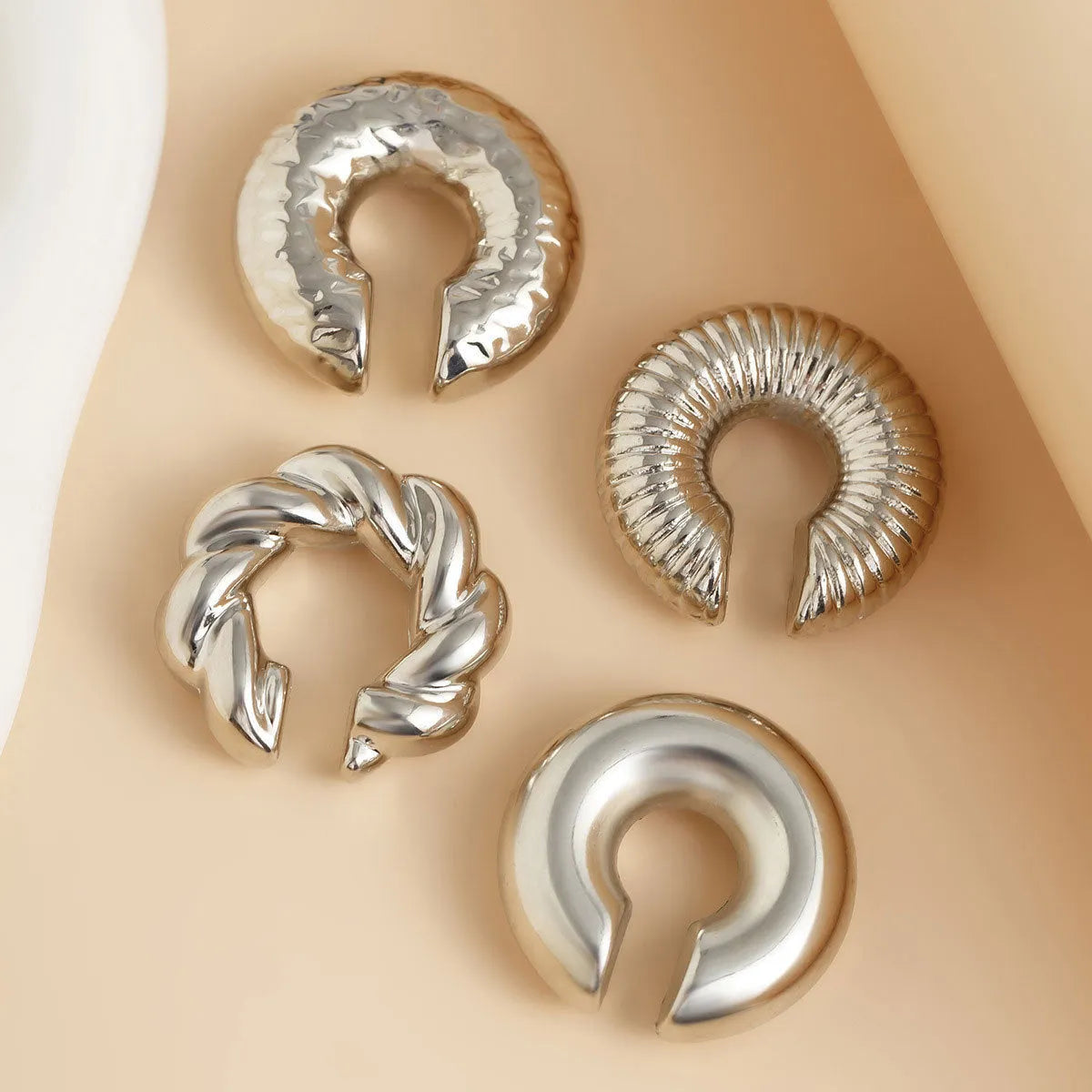 Geometric non-pierced ear clip earrings for women in gold and silver metallic finishes