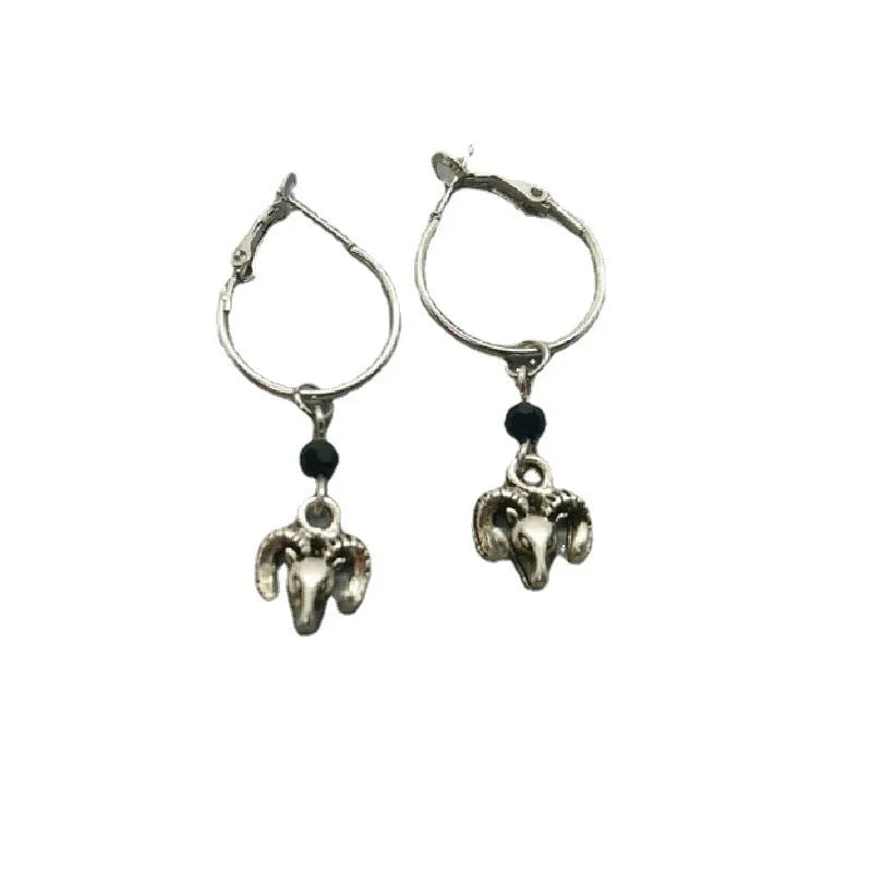 A pair of silver-coloured round ring earrings with a Tibetan Antelope inspired design.