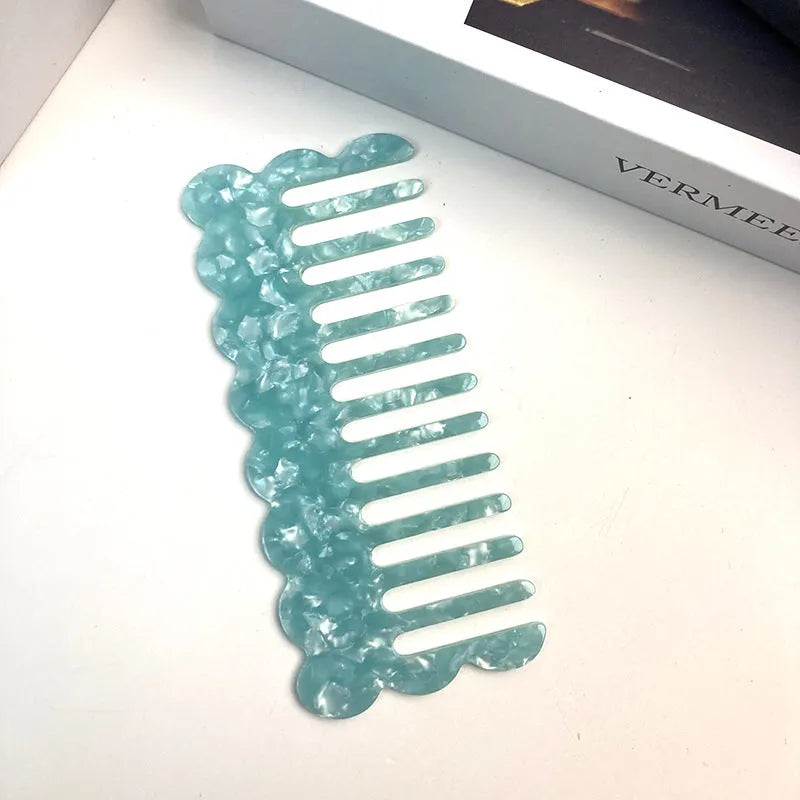 Acetate hair comb with geometric retro wave design in various colours.