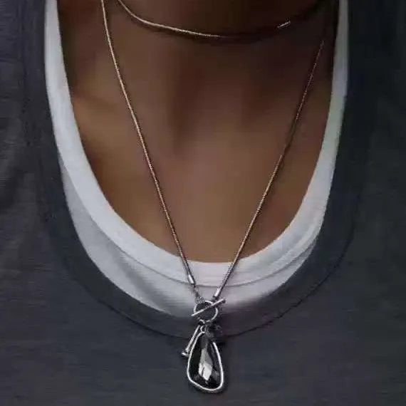 Women's geometric alloy pendant necklace with snake bones chain in blue, champagne, or grey.
