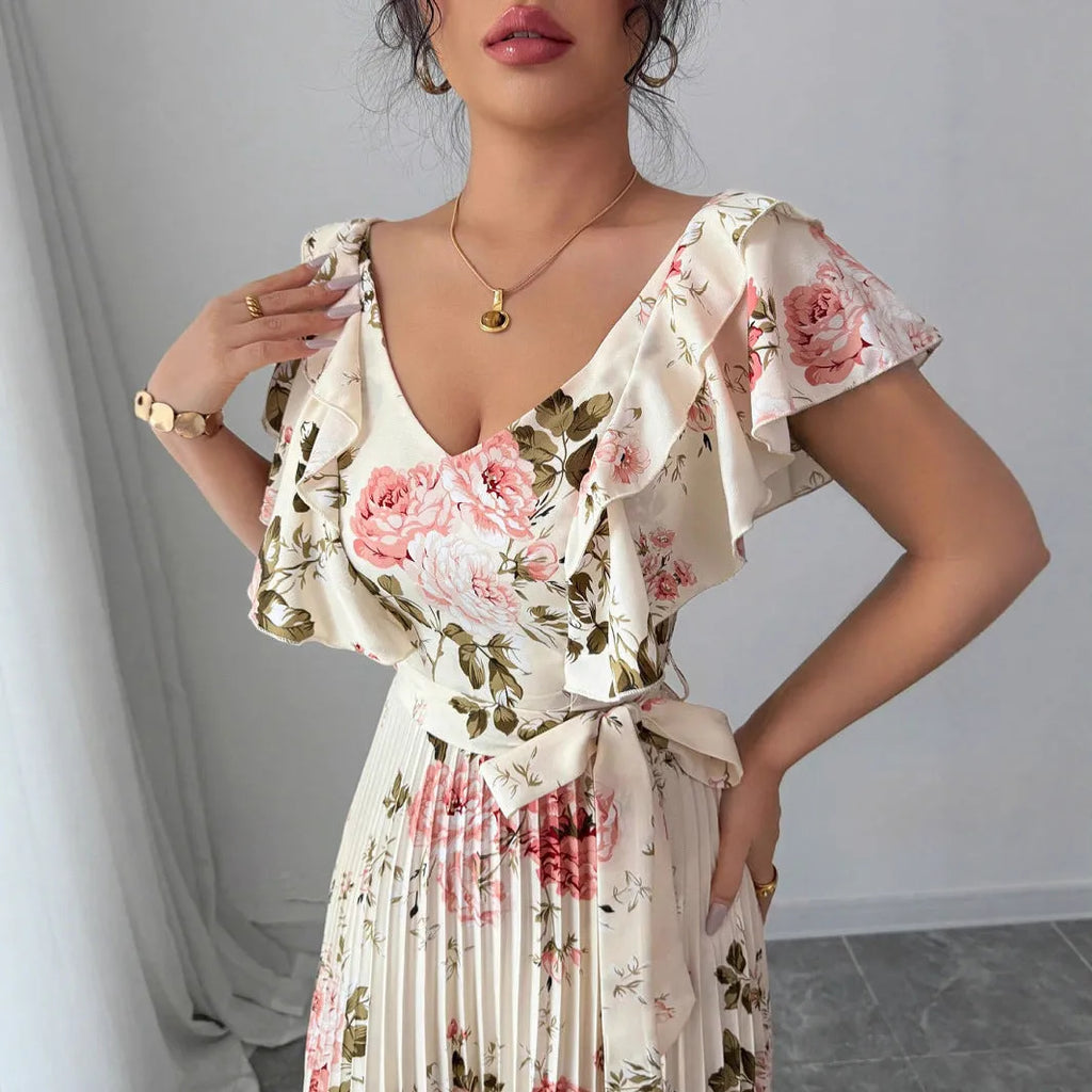 Apricot V-neck floral print dress with ruffled sleeves and an oversized swing skirt.