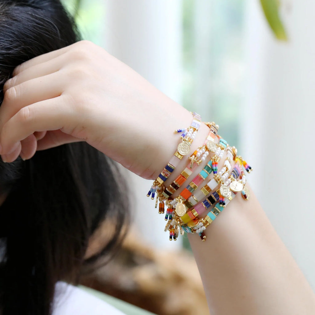 Women's handcrafted bracelet with imitation pearl beads in a European/American style design.