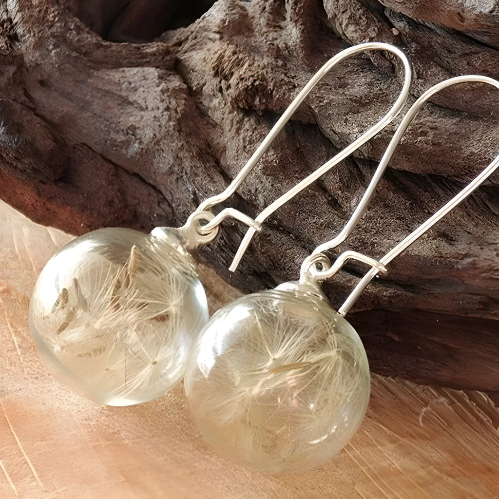 Transparent glass ball earrings with dandelion seed design on silver French hooks