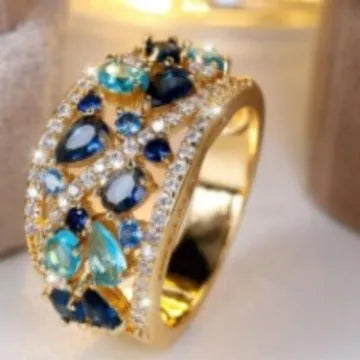 Women's round hollow fashion ring with gem centrepiece in gold or platinum plating