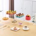 White plastic suit cube dessert display stand with six stackable pieces for table presentation