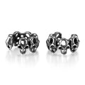 Stainless steel hollow skull ear clips with geometric design and steel colour finish